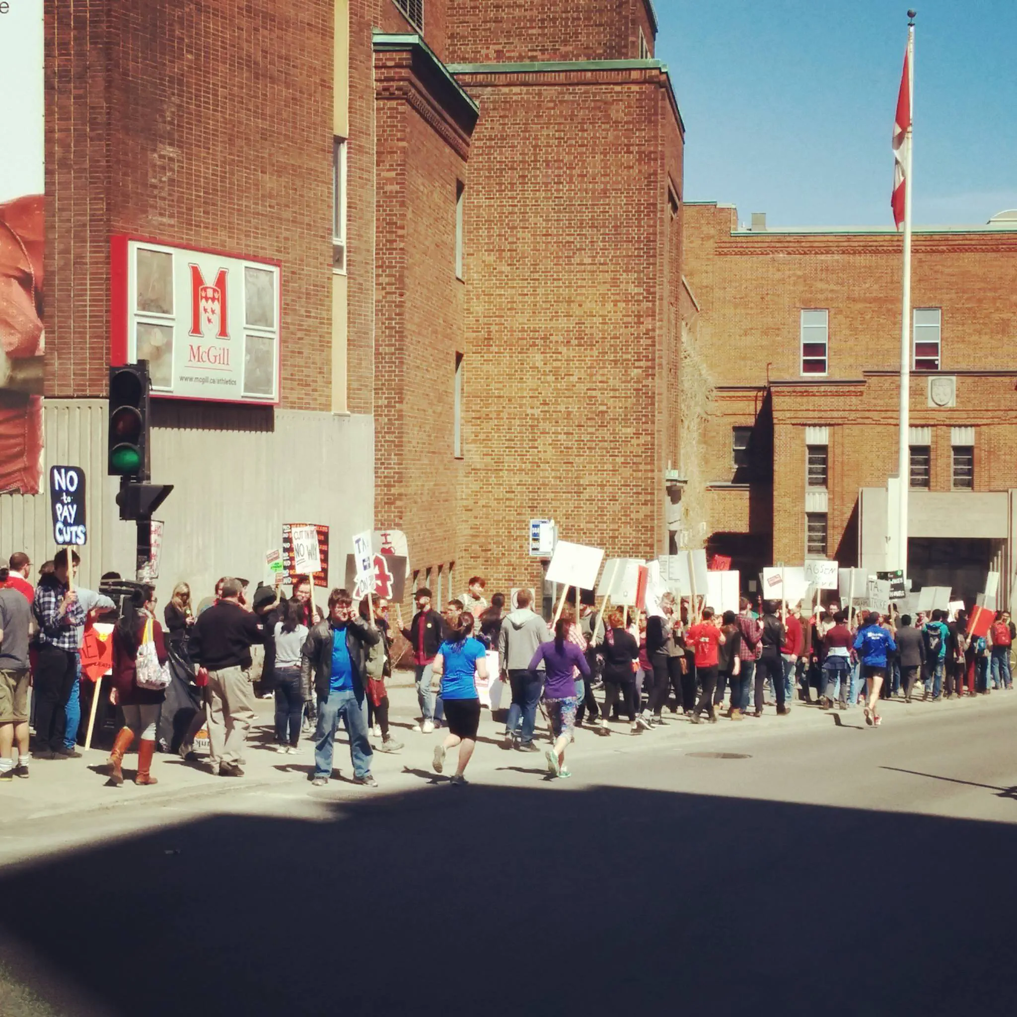 Photo of TAs picketing the Tomlinson Fieldhouse on a one-day TA strike (April 16, 2015).